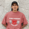 Push Harder Each Day Gym Graphic Unisex T-Shirt – Red Fist and Barbell Design in Coral