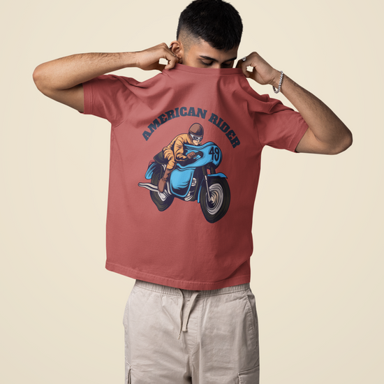 Model wearing coral oversized unisex t-shirt with "American Rider" graphic – Thodacrazyclub
