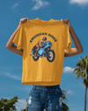 Model holding golden yellow oversized unisex t-shirt with "American Rider" graphic – Thodacrazyclub