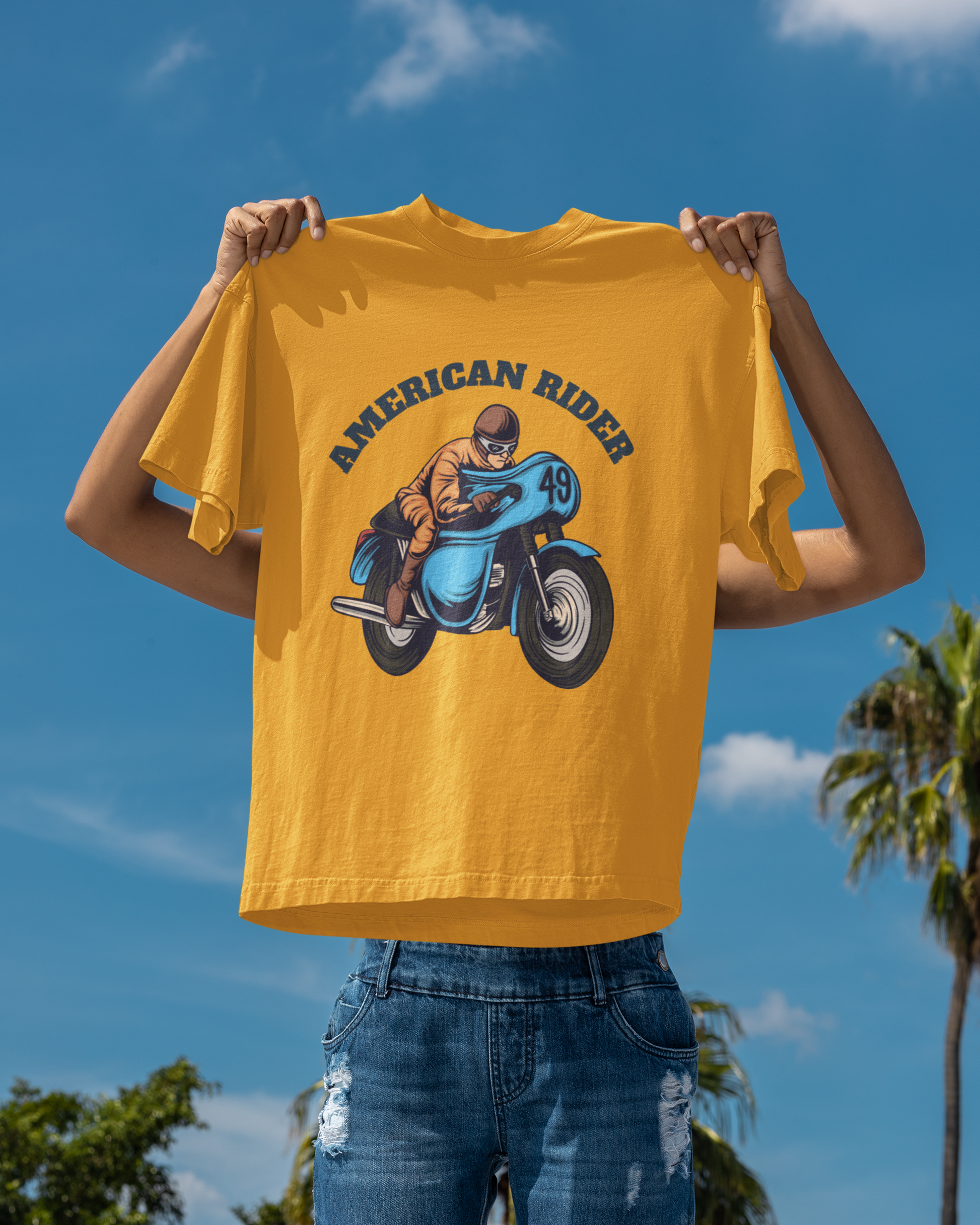 Model holding golden yellow oversized unisex t-shirt with "American Rider" graphic – Thodacrazyclub