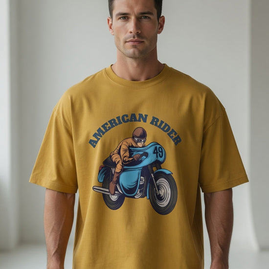 Model wearing mustard yellow oversized unisex t-shirt with "American Rider" graphic – Thodacrazyclub