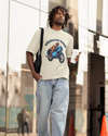 Model wearing off white oversized unisex t-shirt with "American Rider" graphic – Thodacrazyclub