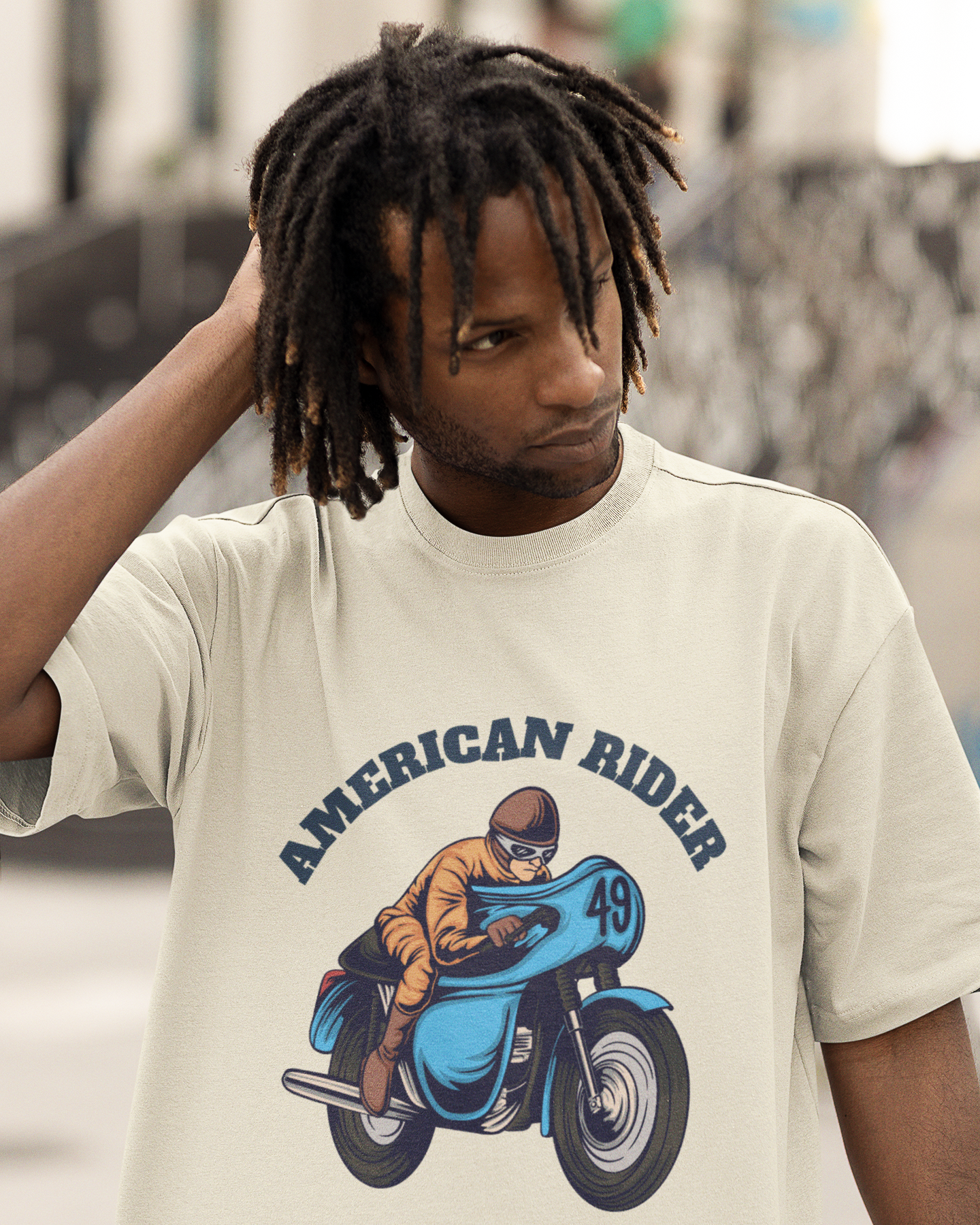 Model wearing off white oversized unisex t-shirt with "American Rider" graphic – Thodacrazyclub