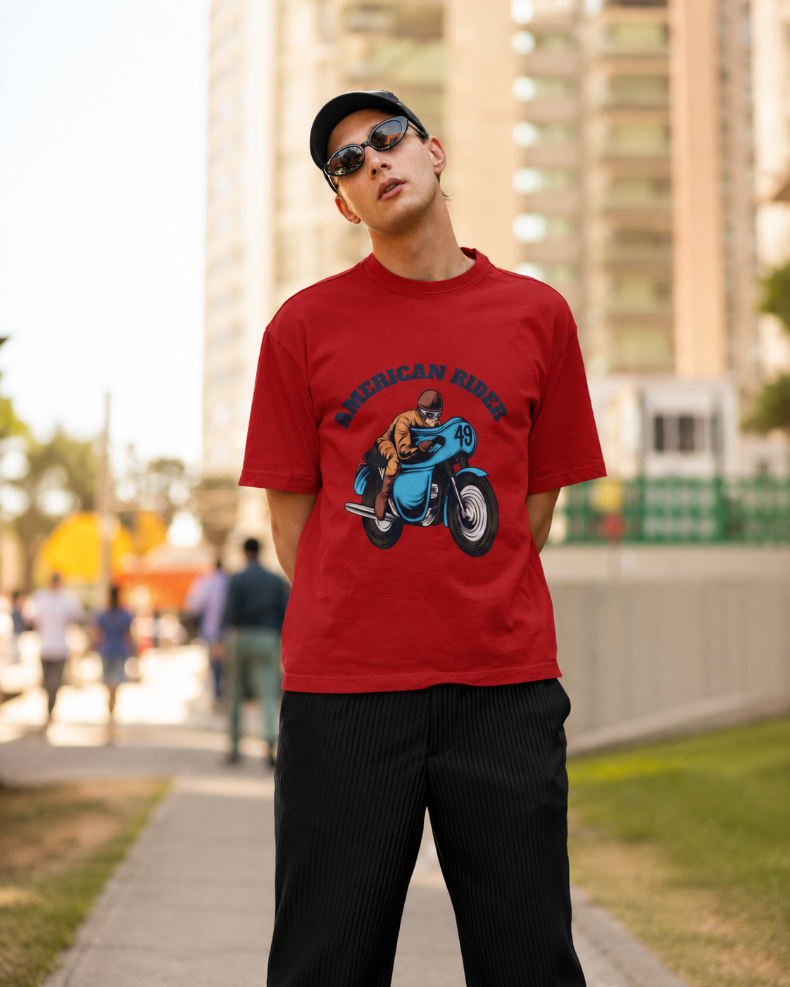 Model wearing red oversized unisex t-shirt with "American Rider" graphic – Thodacrazyclub